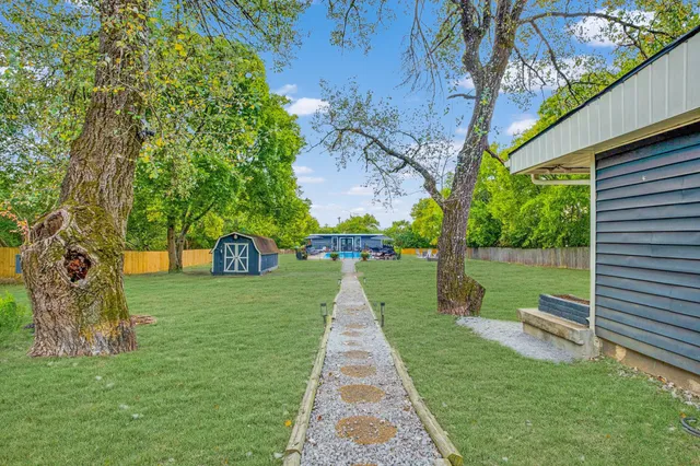 a view of a garden with a lake