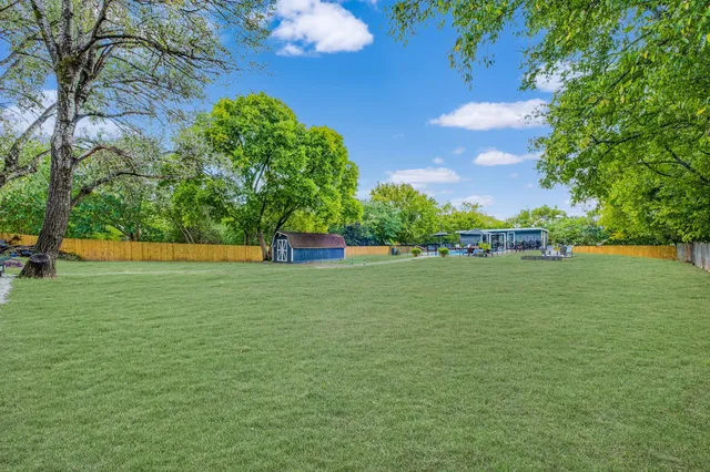 a view of outdoor space with deck and yard