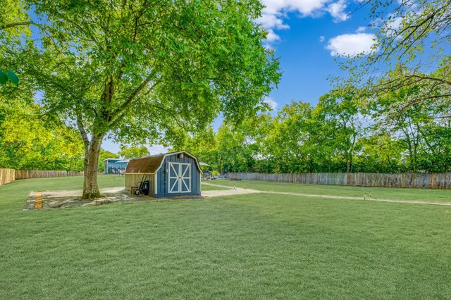 a view of a house with a big yard