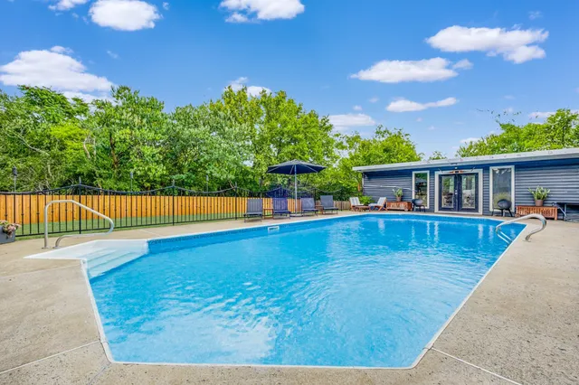 a view of a house with swimming pool
