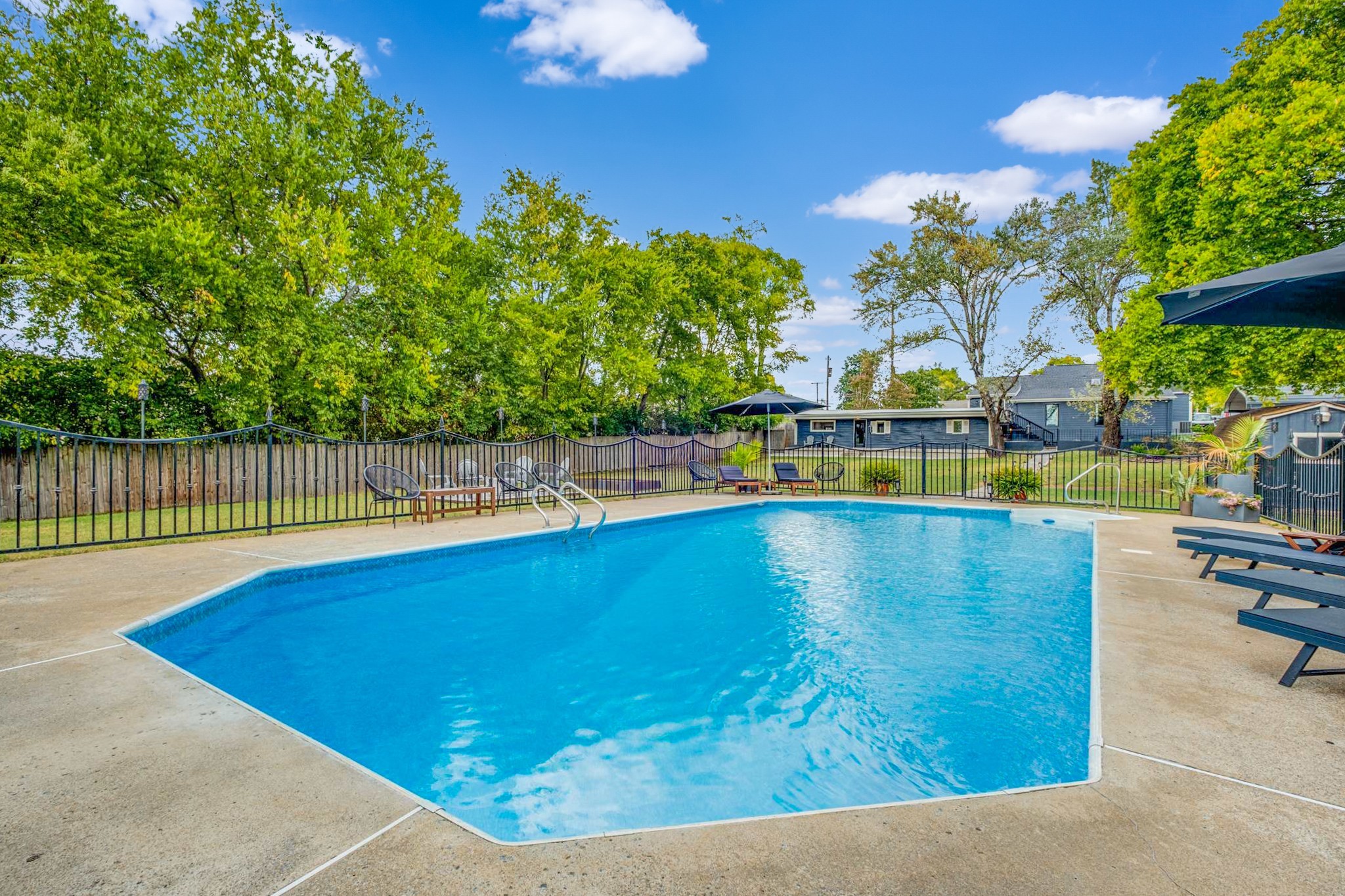 562 B Neelys Bend Road Madison, TN 37115 - Photo 24 of 29 a view of a swimming pool with an outdoor seating and a yard