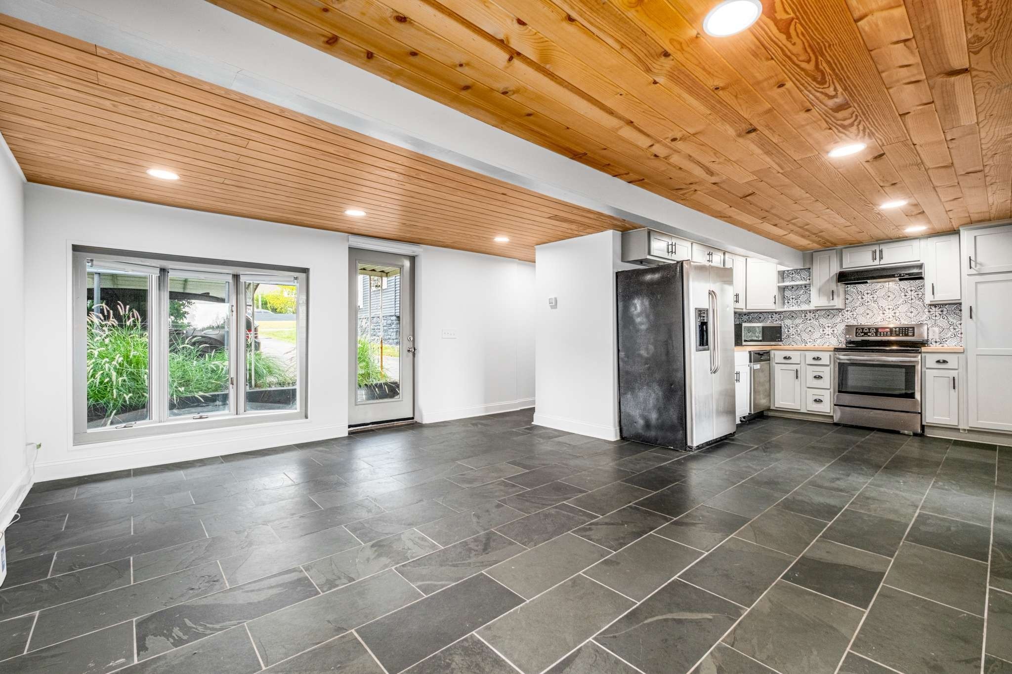 562 B Neelys Bend Road Madison, TN 37115 - Photo 5 of 29 a view of a electric appliances in kitchen and empty room with windows