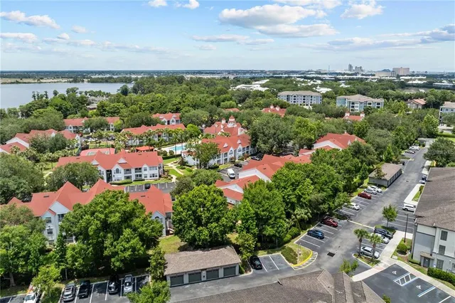 an aerial view of a house with a yard and garden