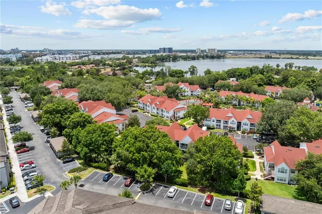 a living room with furniture a lamp and a chandelier