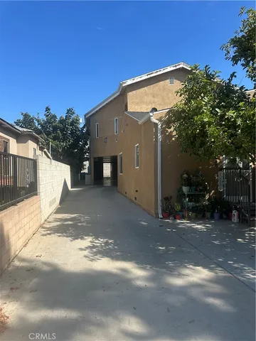 a view of a house with a street