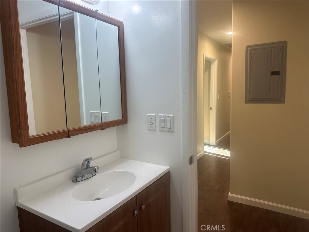 14233 Tiara Street, Unit 3 Sherman Oaks, CA 91401 - Photo 19 of 20 a bathroom with a sink and a mirror
