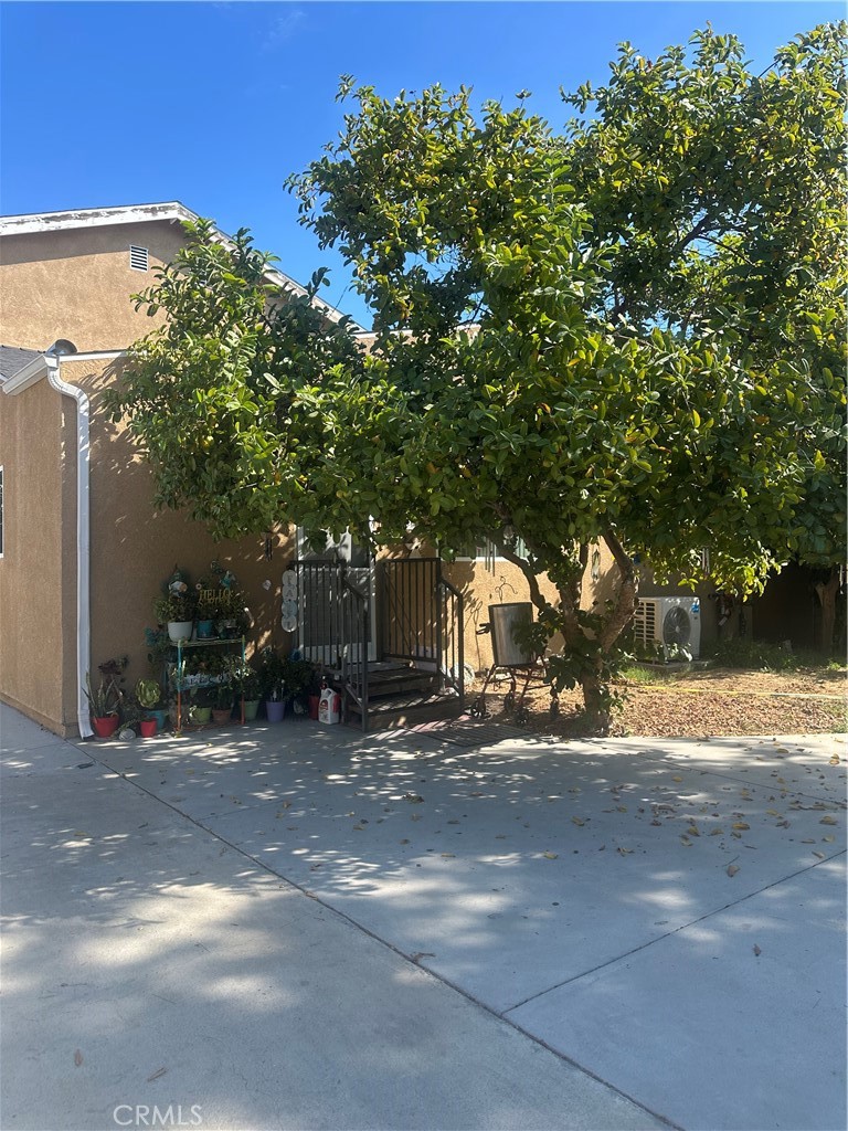 14233 Tiara Street, Unit 3 Sherman Oaks, CA 91401 - Photo 3 of 20 a view of a street with a building in the background
