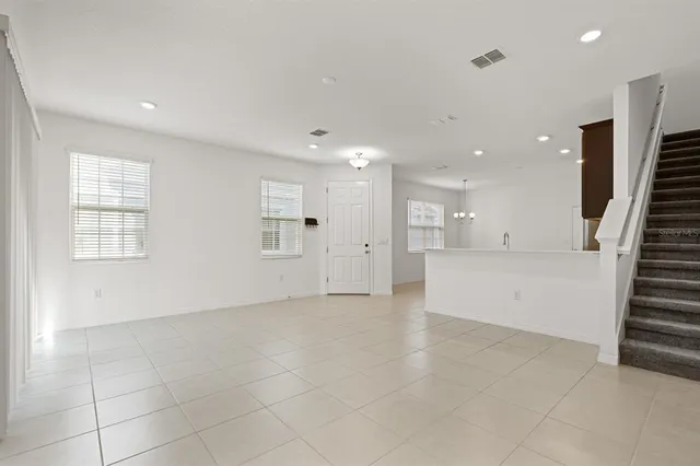 a kitchen with stainless steel appliances a refrigerator and a stove top oven