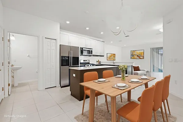 a kitchen with stainless steel appliances a stove sink microwave and cabinets