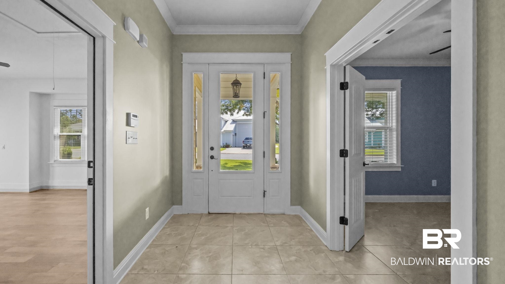 12361 Reunion Place Foley, AL 36535 - Photo 5 of 43 Entryway featuring plenty of natural light, ornamental molding, and light tile patterned floors