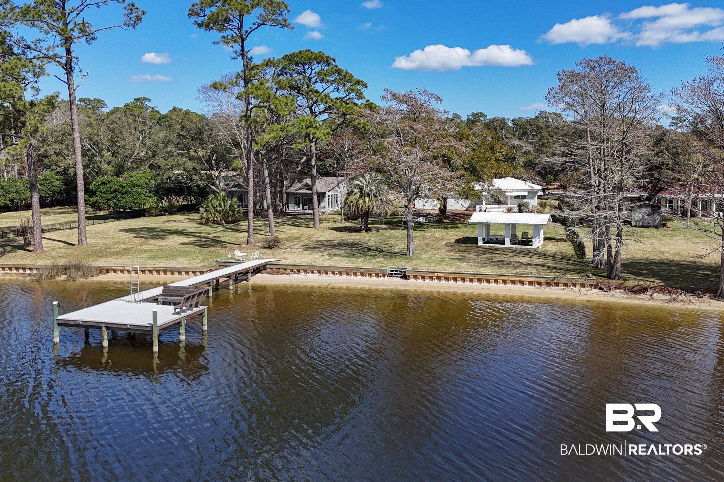 9459 Soldier Creek Road Lillian, AL 36549 - Photo 41 of 54 Dock area featuring a water view, boat lift, and a yard