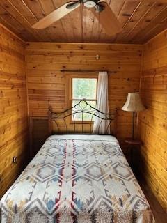 52358 Elder Road, Unit 52 Big Creek, CA 93605 - Photo 17 of 38 a bedroom with a bed and a window