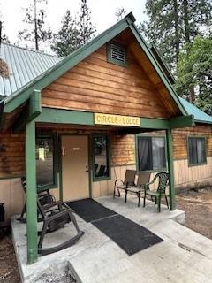 52358 Elder Road, Unit 52 Big Creek, CA 93605 - Photo 32 of 38 a backyard of a house with seating space