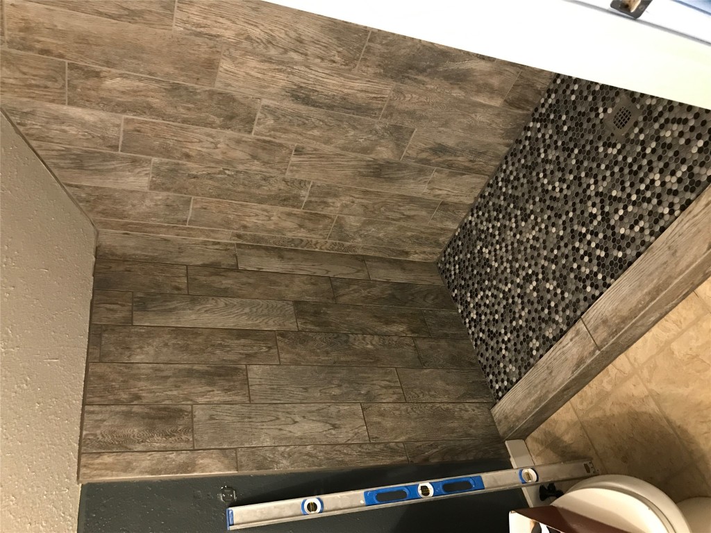 615 West N Loop Boulevard, Unit BUILDING A Austin, TX 78751 - Photo 1 of 21 a bathroom with a shower curtain