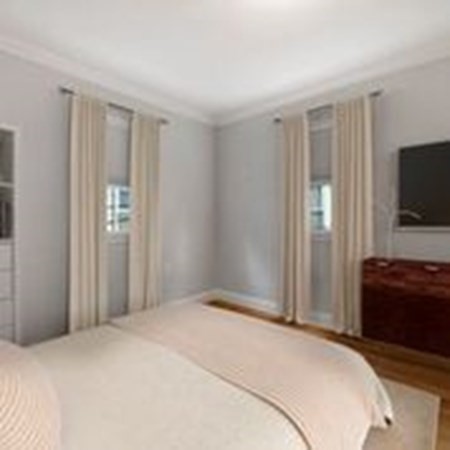 2 Reed St Court, Unit 2 Cambridge, MA 02140 - Photo 14 of 31 a bedroom with a bed and a flat screen tv