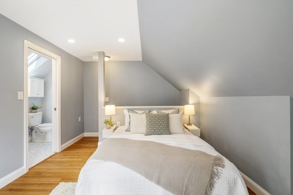 2 Reed St Court, Unit 2 Cambridge, MA 02140 - Photo 17 of 31 a bedroom with a bed and wooden floor