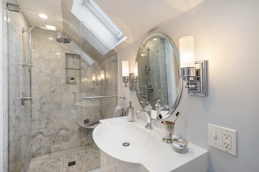 2 Reed St Court, Unit 2 Cambridge, MA 02140 - Photo 19 of 31 a bathroom with a sink mirror and shower