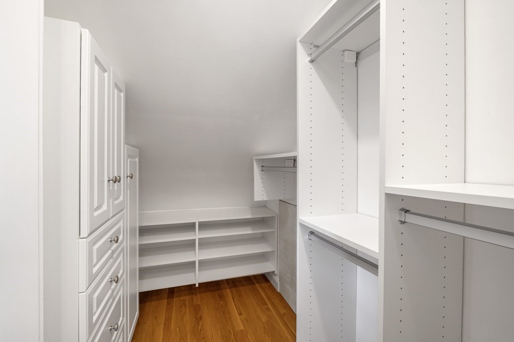 2 Reed St Court, Unit 2 Cambridge, MA 02140 - Photo 23 of 31 a view of walk in closet with empty racks
