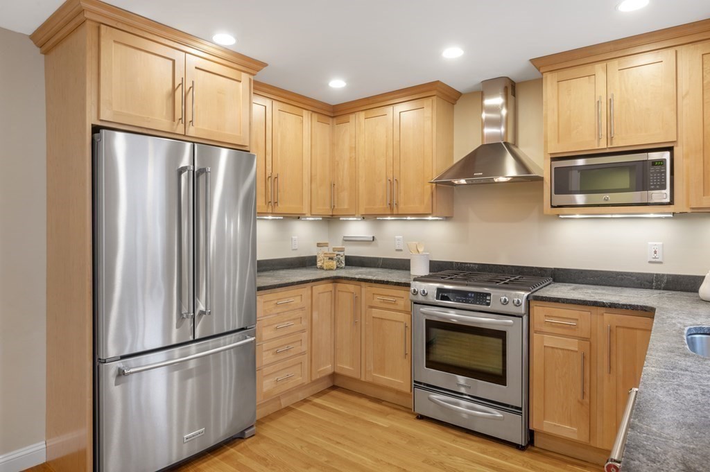 2 Reed St Court, Unit 2 Cambridge, MA 02140 - Photo 4 of 31 a kitchen with stainless steel appliances granite countertop a refrigerator stove and microwave