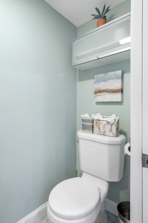 2 Reed St Court, Unit 2 Cambridge, MA 02140 - Photo 10 of 31 a white toilet sitting next to a bathroom sink