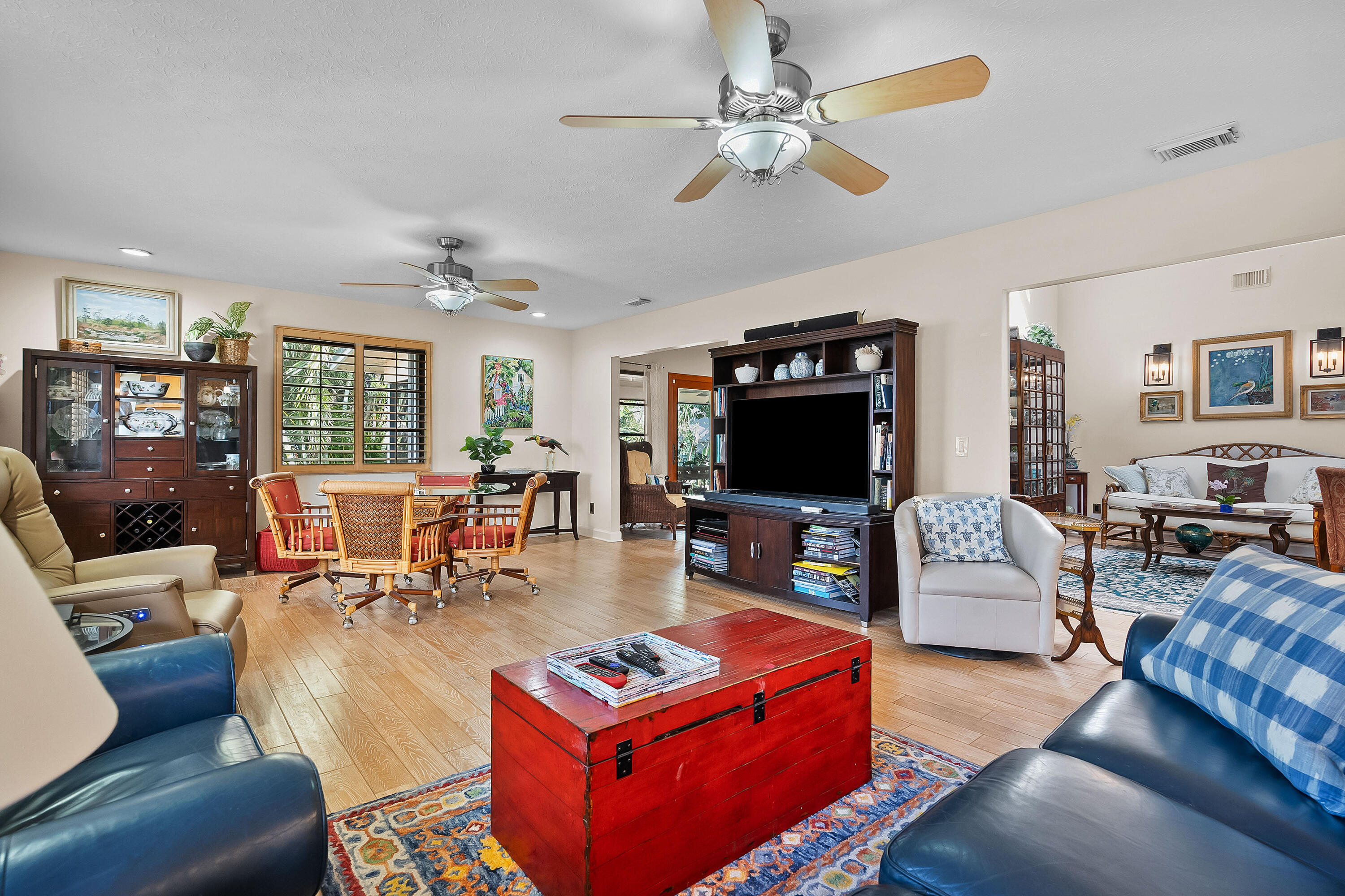5105 Southeast Matousek Street Stuart, FL 34997 - Photo 12 of 48 a living room with furniture and a flat screen tv