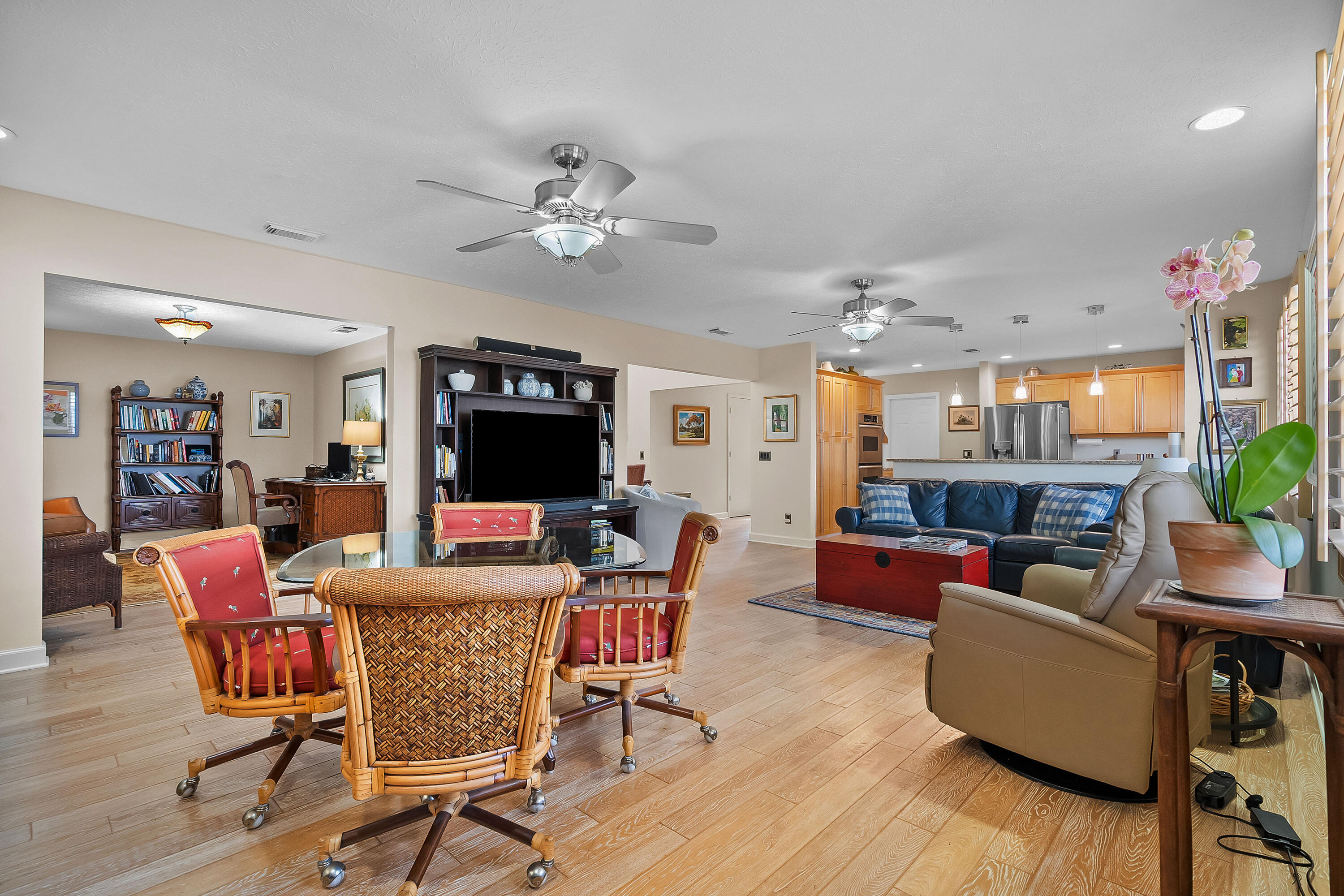 5105 Southeast Matousek Street Stuart, FL 34997 - Photo 13 of 48 a living room with furniture kitchen view and a wooden floor