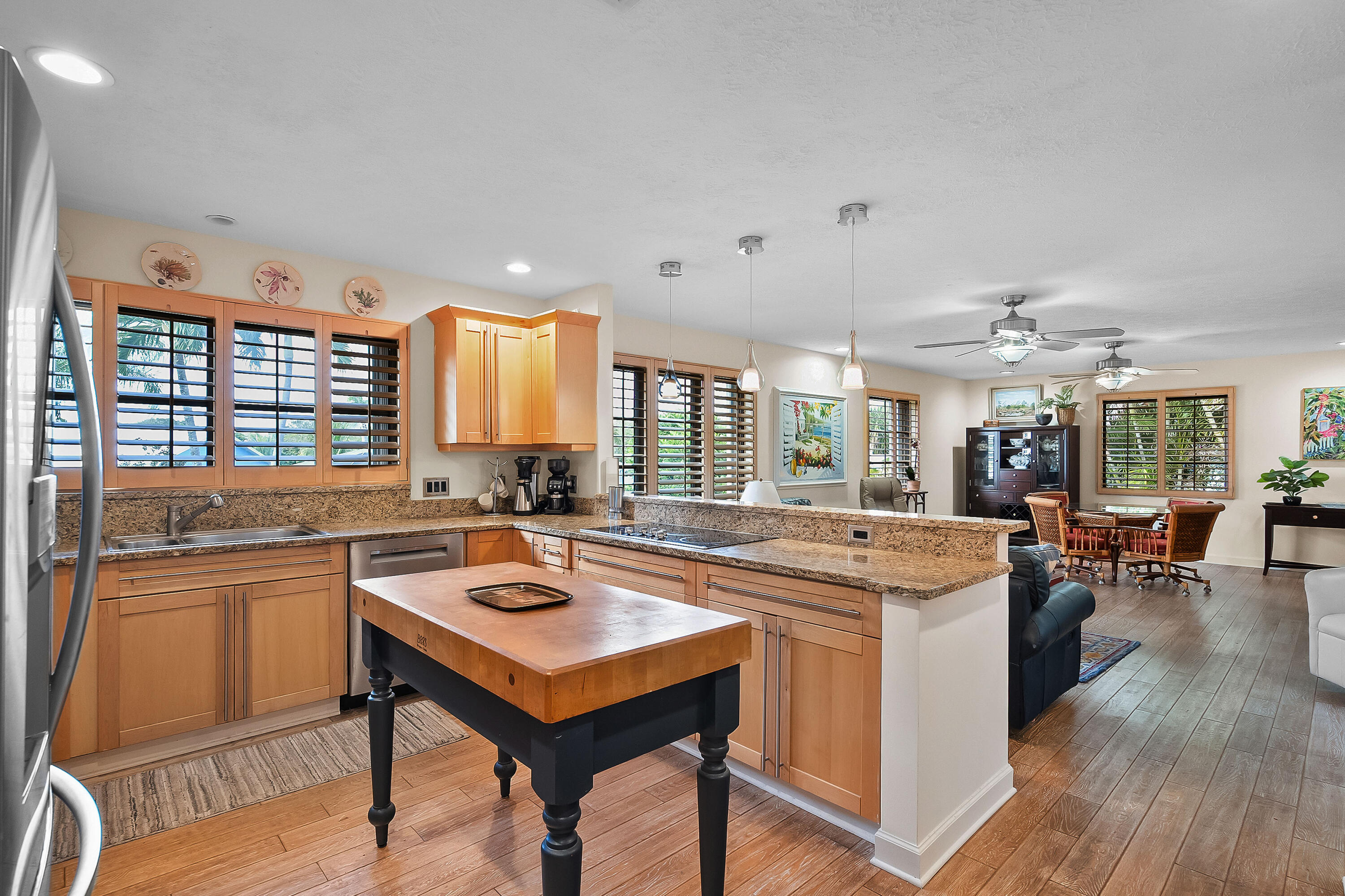 5105 Southeast Matousek Street Stuart, FL 34997 - Photo 15 of 48 a kitchen with a stove a refrigerator and wooden floor