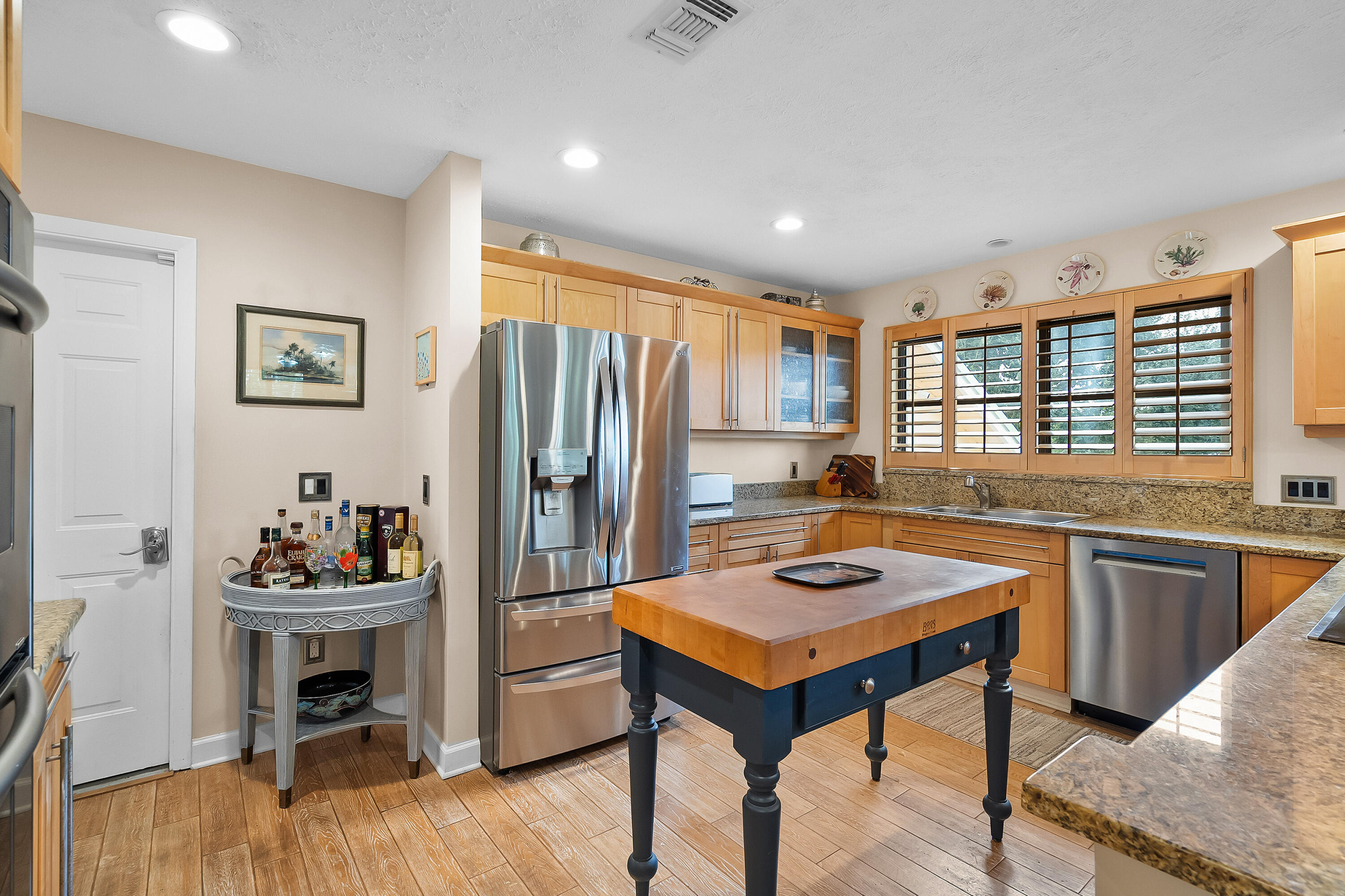 5105 Southeast Matousek Street Stuart, FL 34997 - Photo 18 of 48 a kitchen with a refrigerator and a sink