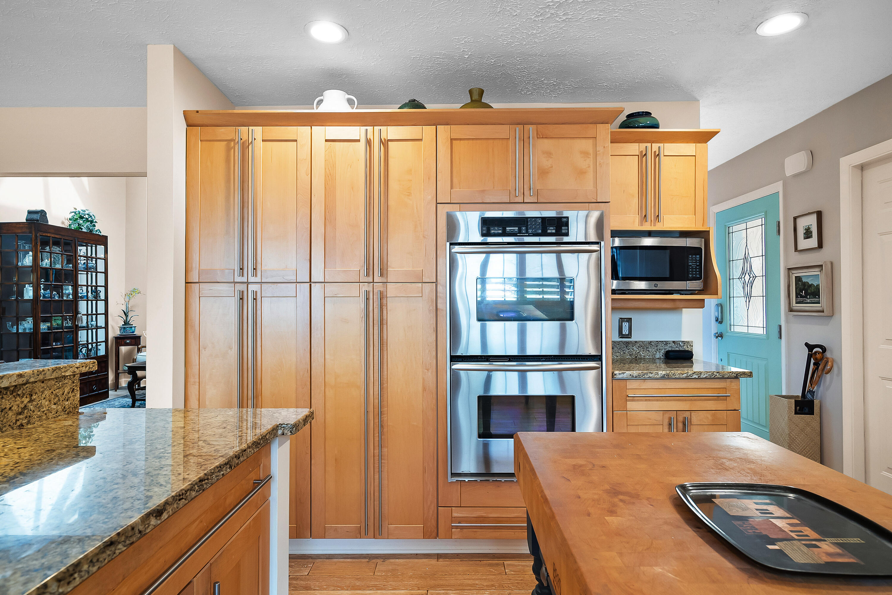 5105 Southeast Matousek Street Stuart, FL 34997 - Photo 19 of 48 a kitchen with stainless steel appliances granite countertop a refrigerator and a stove top oven