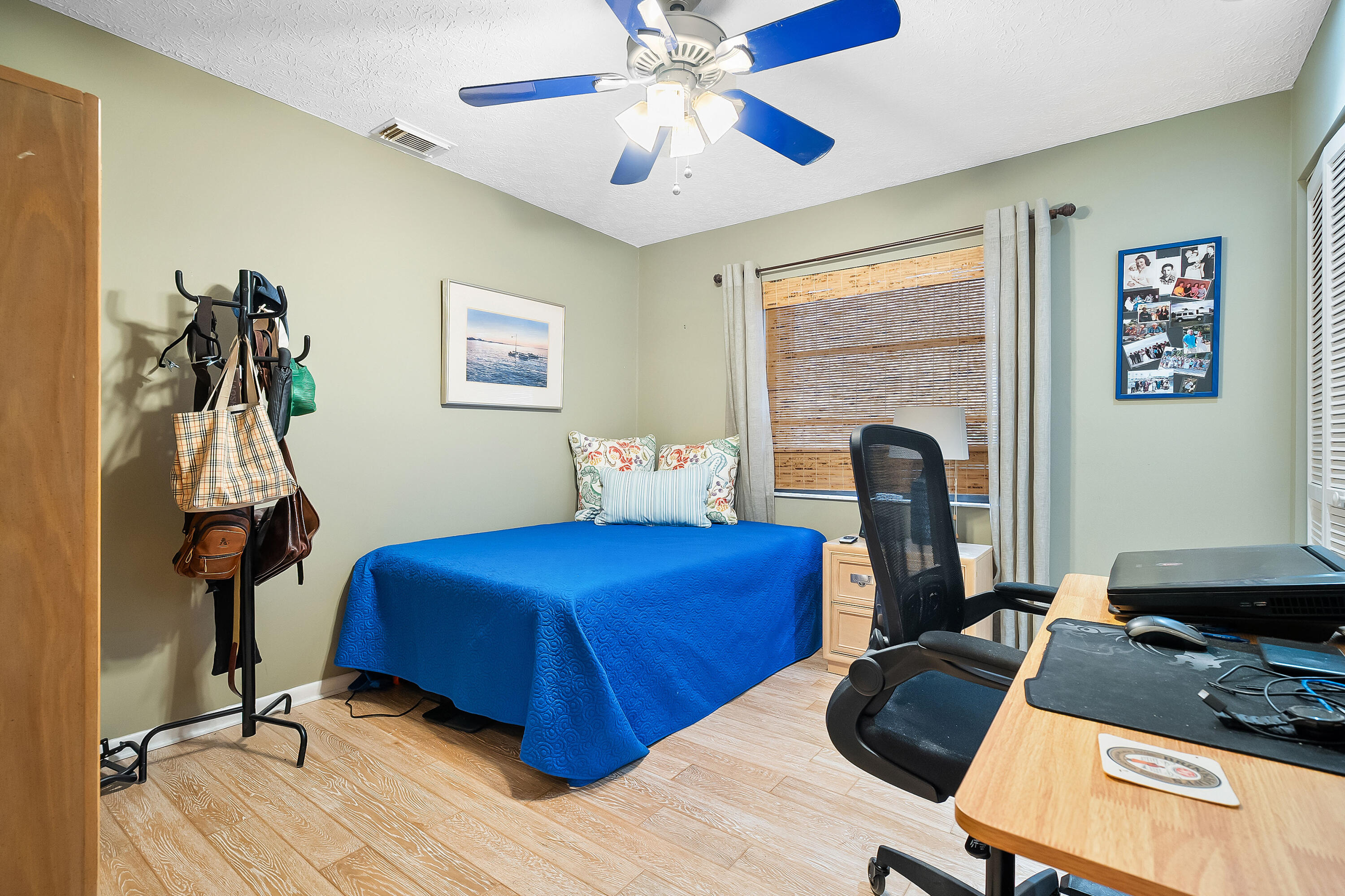 5105 Southeast Matousek Street Stuart, FL 34997 - Photo 23 of 48 a bedroom with furniture and a fireplace