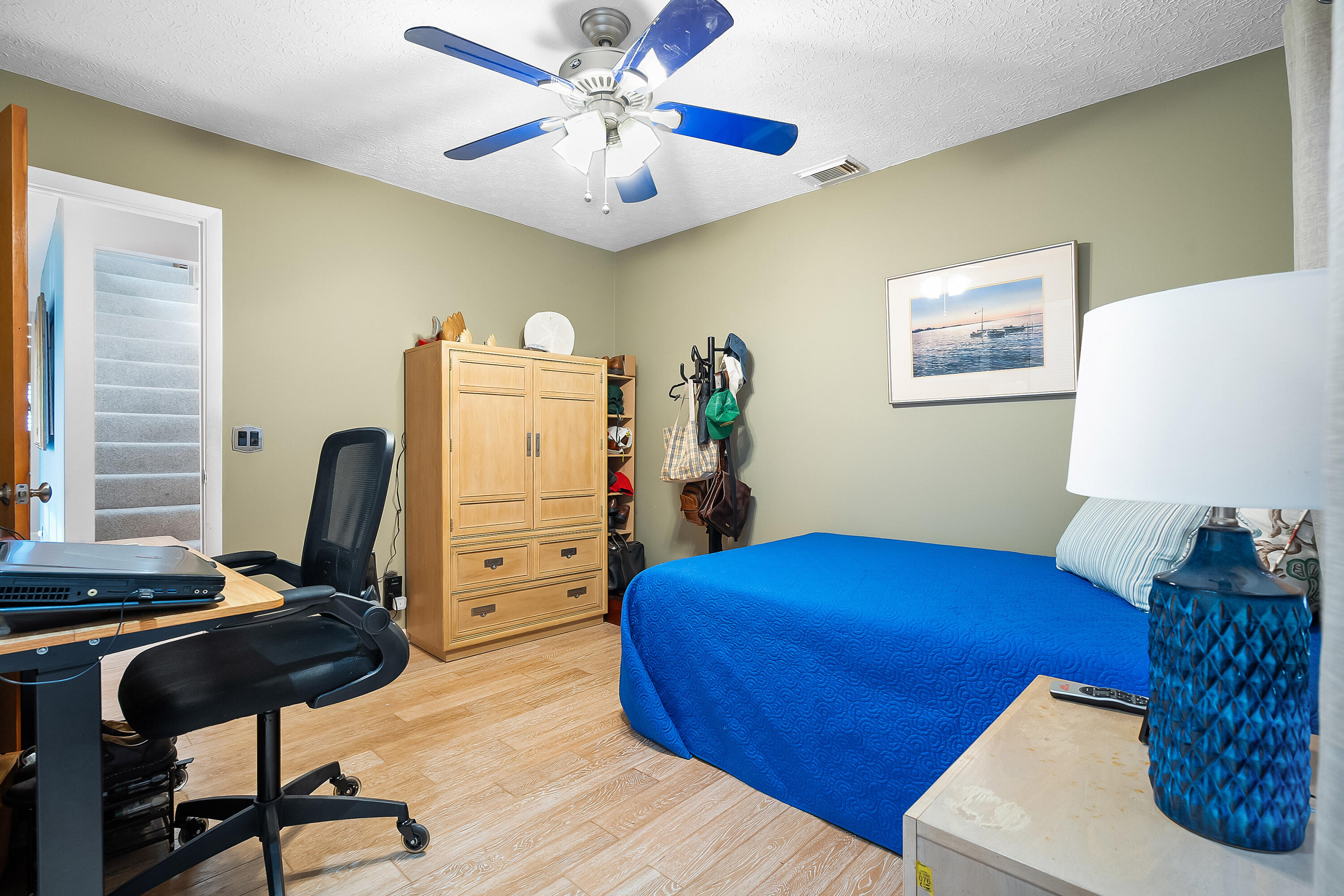 5105 Southeast Matousek Street Stuart, FL 34997 - Photo 24 of 48 a view of a workspace with furniture and a window