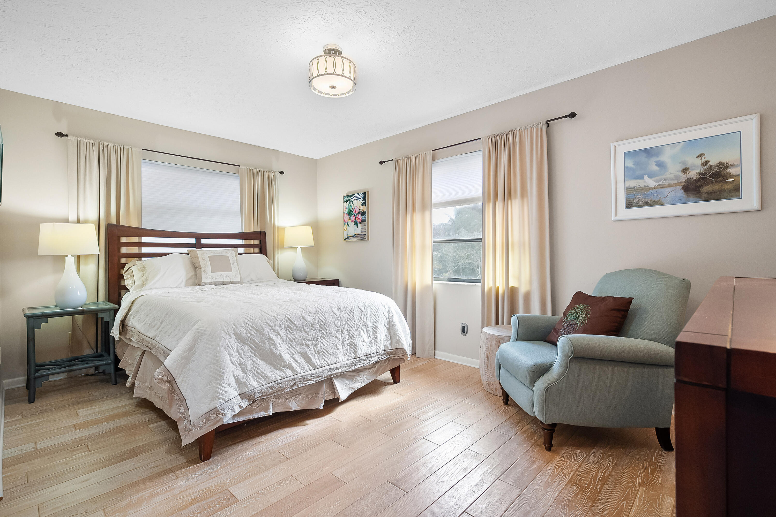 5105 Southeast Matousek Street Stuart, FL 34997 - Photo 25 of 48 a bedroom with a bed couch and a window