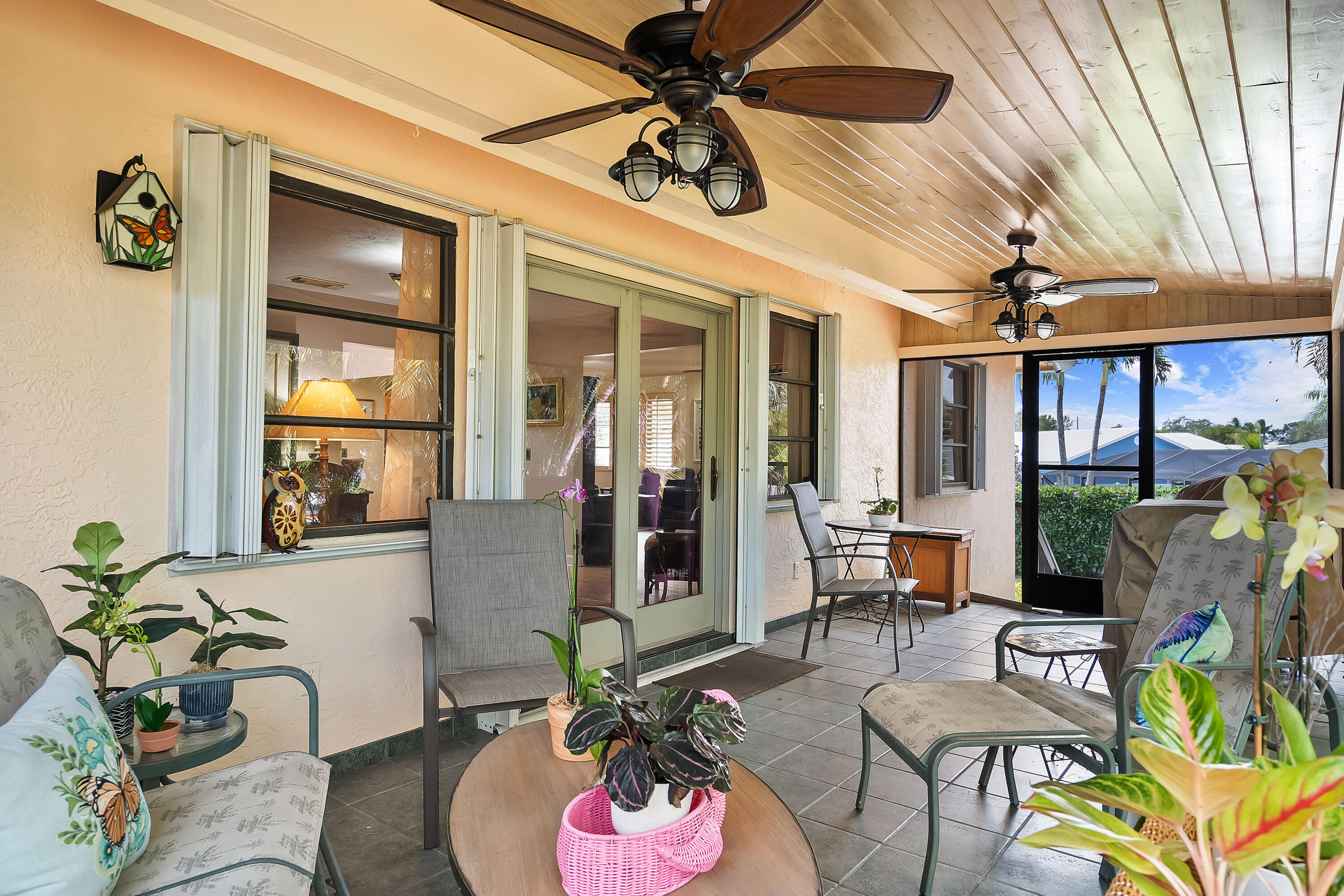 5105 Southeast Matousek Street Stuart, FL 34997 - Photo 29 of 48 a living room with furniture and a potted plant