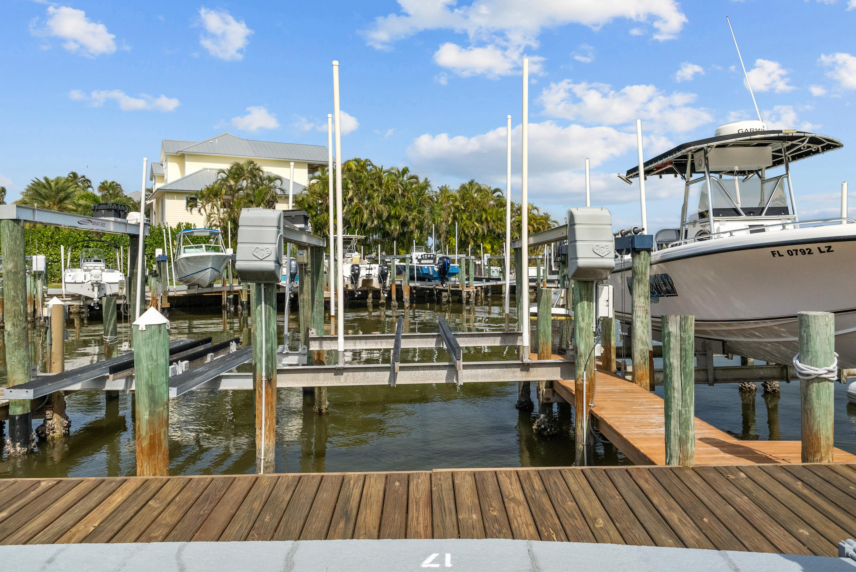 5105 Southeast Matousek Street Stuart, FL 34997 - Photo 39 of 48 a view of a balcony with dining table & chairs