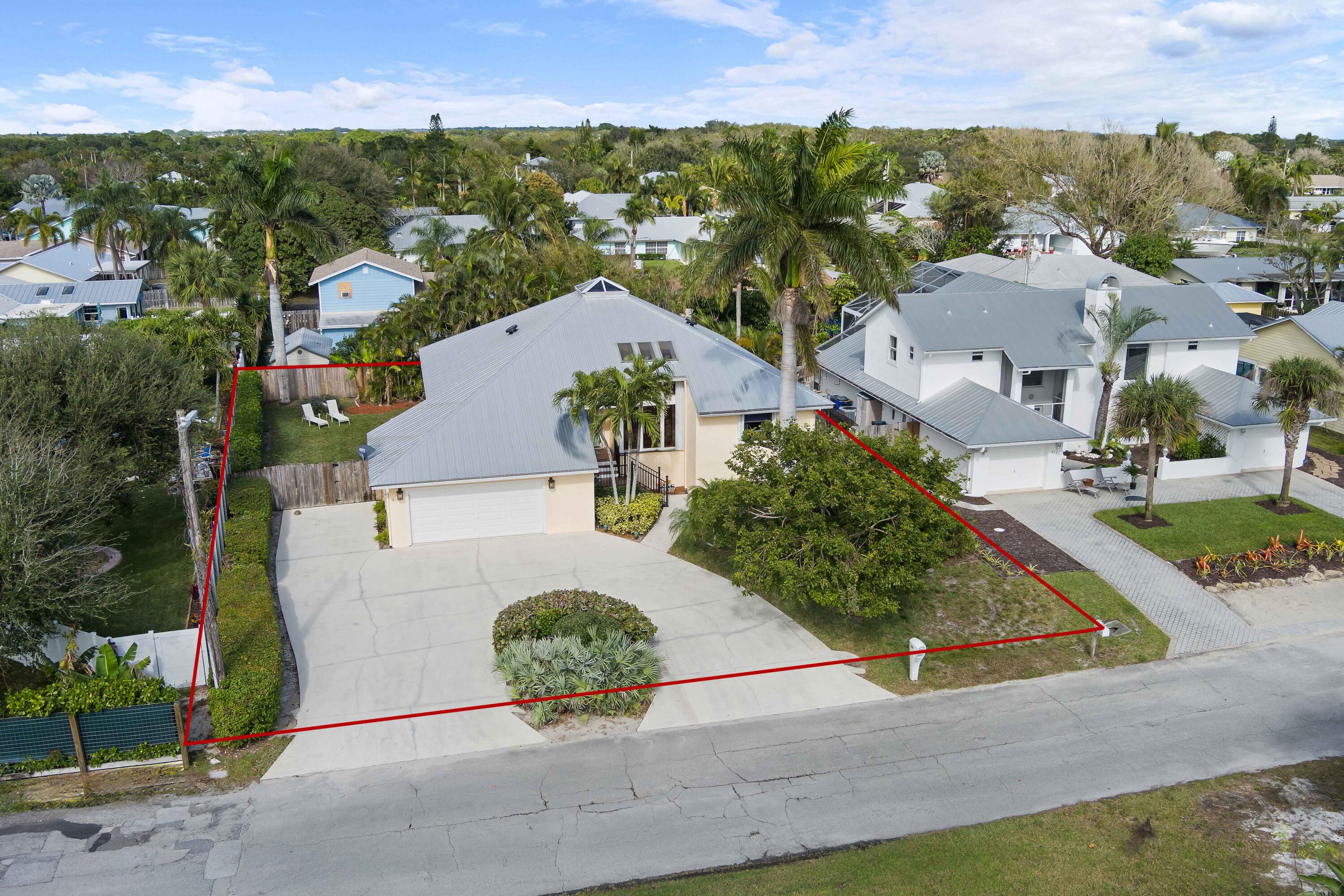5105 Southeast Matousek Street Stuart, FL 34997 - Photo 4 of 48 an aerial view of a house