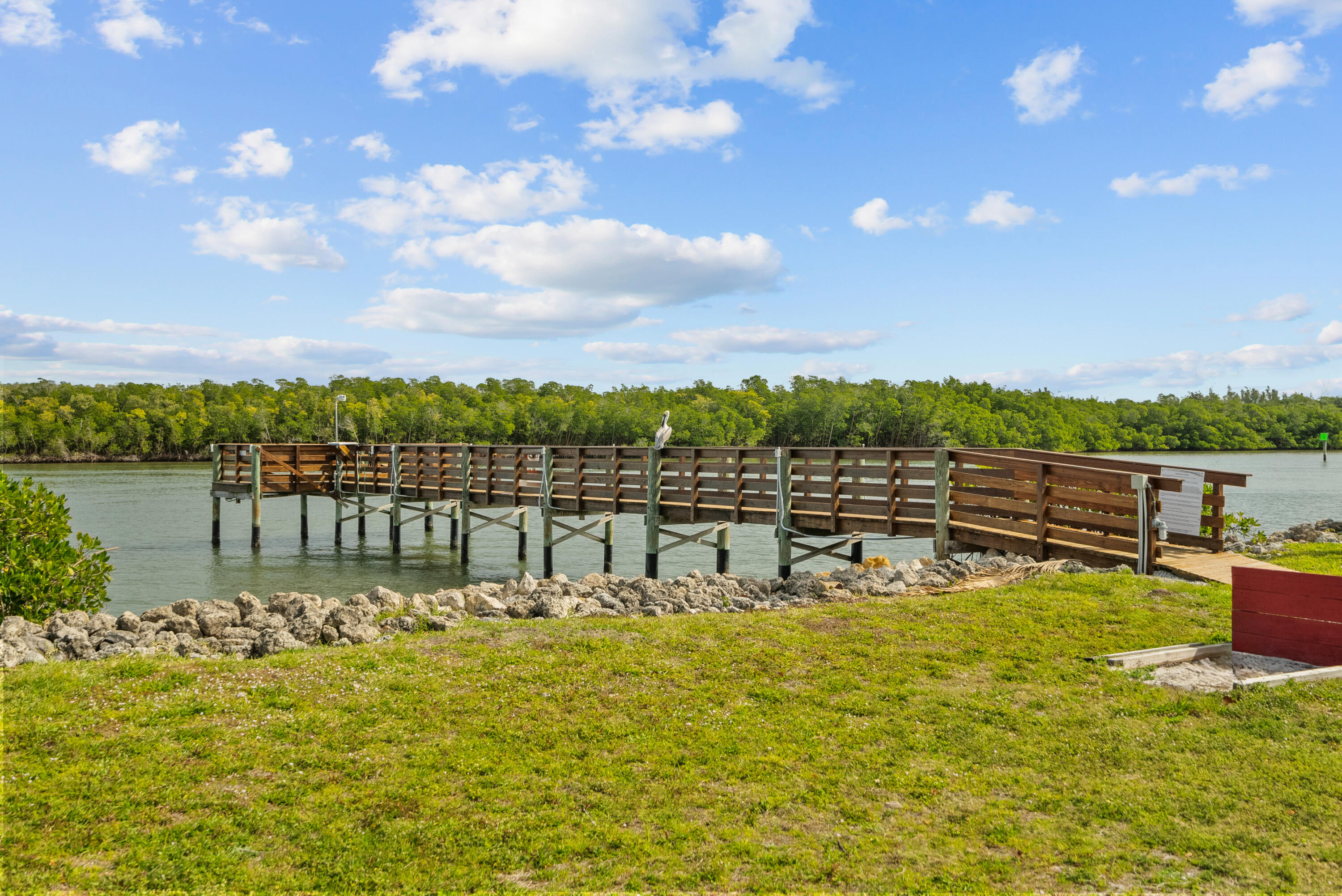 5105 Southeast Matousek Street Stuart, FL 34997 - Photo 43 of 48 a view of a lake with houses in the back