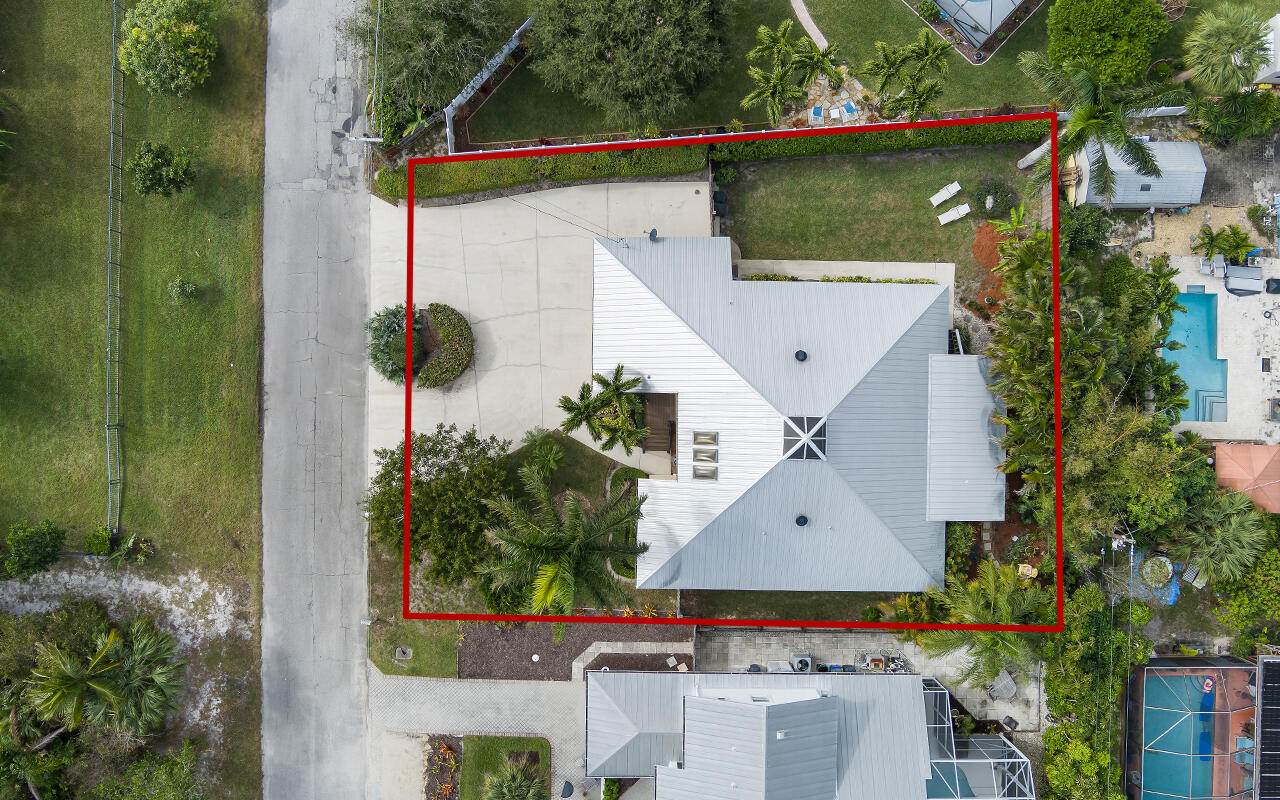 5105 Southeast Matousek Street Stuart, FL 34997 - Photo 5 of 48 an aerial view of a house