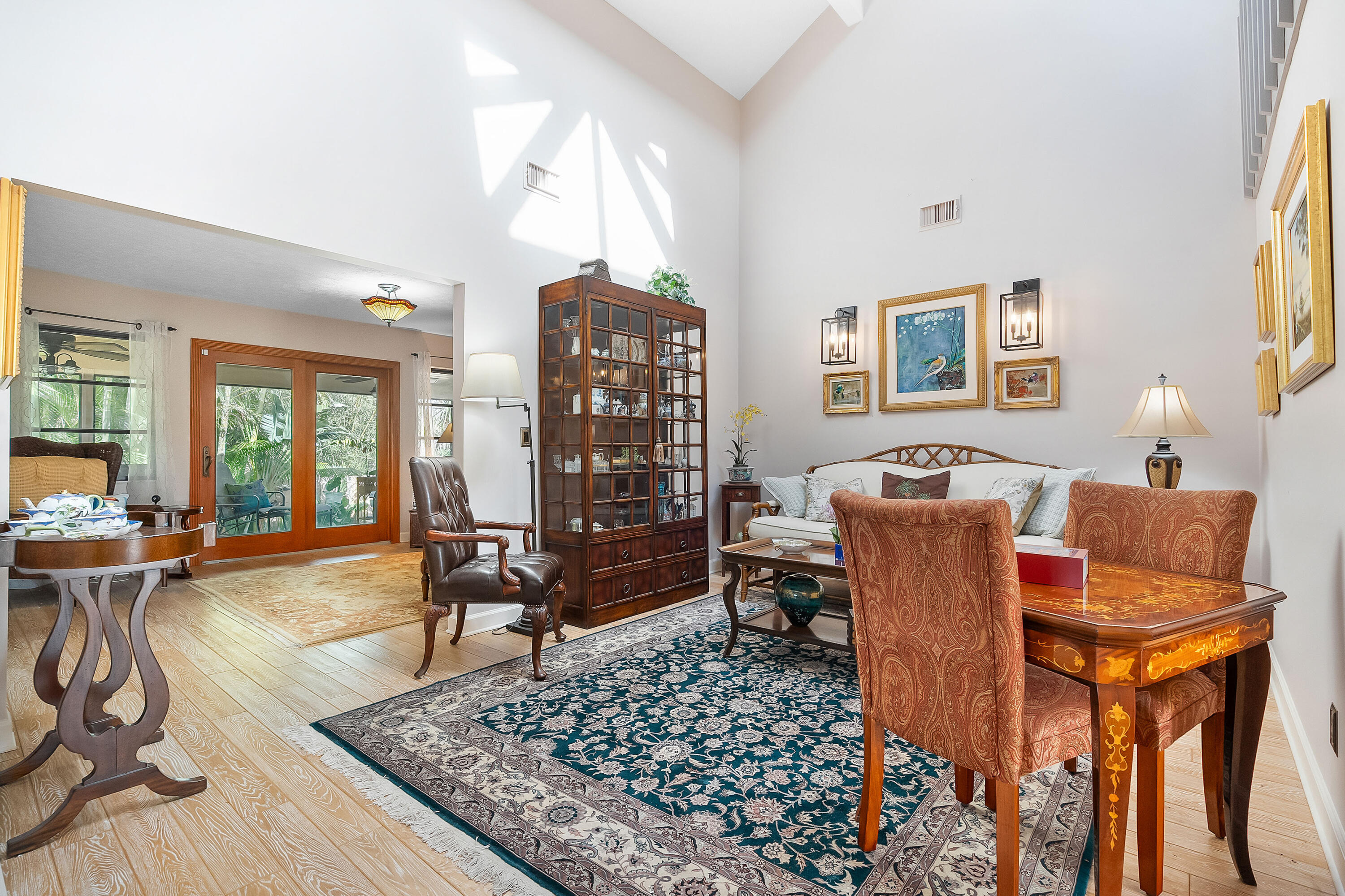 5105 Southeast Matousek Street Stuart, FL 34997 - Photo 10 of 48 a living room with furniture a rug and a large window