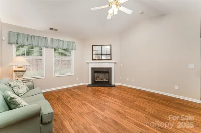 a view of livingroom with furniture window and wooden floor