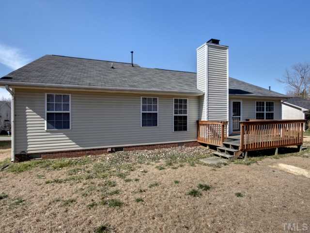 5633 Lighthall Lane Raleigh, NC 27604 - Photo 11 of 11 Rear of the home showing the spacious 12x10 deck. Home is vinyl siding , making it low maintenance.