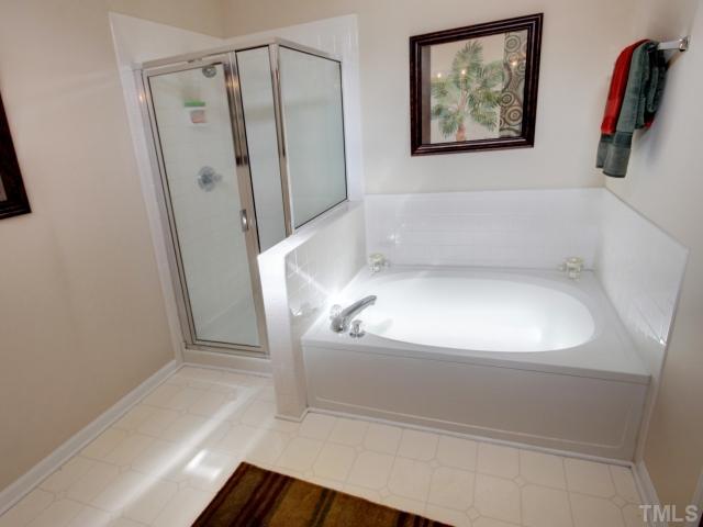 5633 Lighthall Lane Raleigh, NC 27604 - Photo 8 of 11 Master bathroom with garden tub, separate shower, and double vanity.