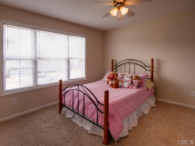 5633 Lighthall Lane Raleigh, NC 27604 - Photo 9 of 11 One of the spacious secondary bedrooms with wall of windows.