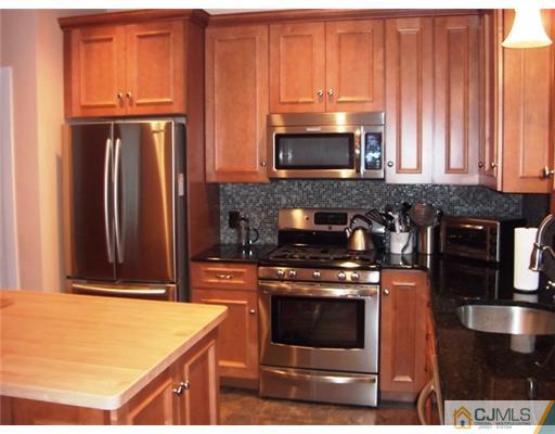 61 Jefferson Road Mercer County, NJ 08540 - Photo 2 of 15 a kitchen with stainless steel appliances granite countertop a stove a microwave and a refrigerator