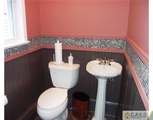 61 Jefferson Road Mercer County, NJ 08540 - Photo 12 of 15 a bathroom with a sink toilet and a mirror