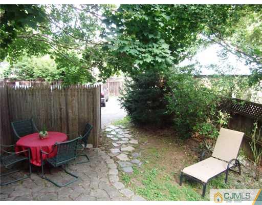 61 Jefferson Road Mercer County, NJ 08540 - Photo 14 of 15 a view of a backyard with furniture and a grill