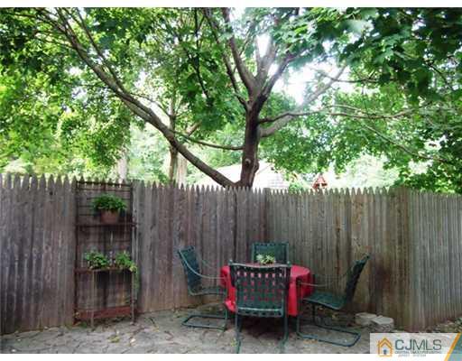 61 Jefferson Road Mercer County, NJ 08540 - Photo 15 of 15 a patio with table and chairs