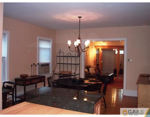 61 Jefferson Road Mercer County, NJ 08540 - Photo 3 of 15 a living room with furniture and a chandelier