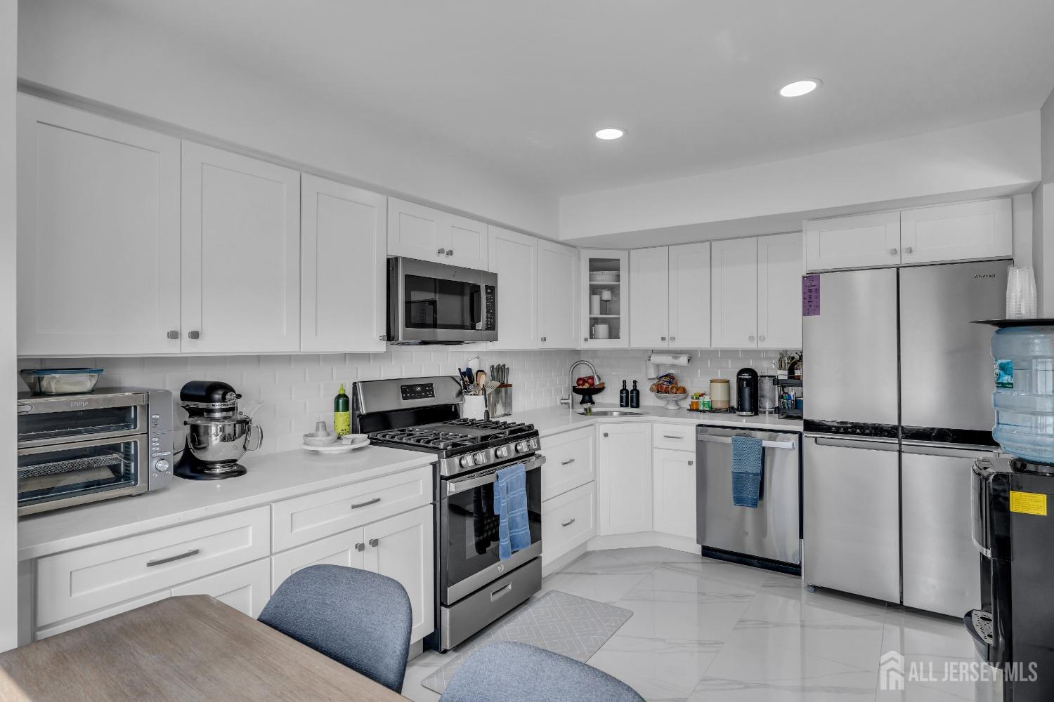 1933 Raspberry Court Edison, NJ 08817 - Photo 13 of 30 a kitchen with cabinets stainless steel appliances and a counter space