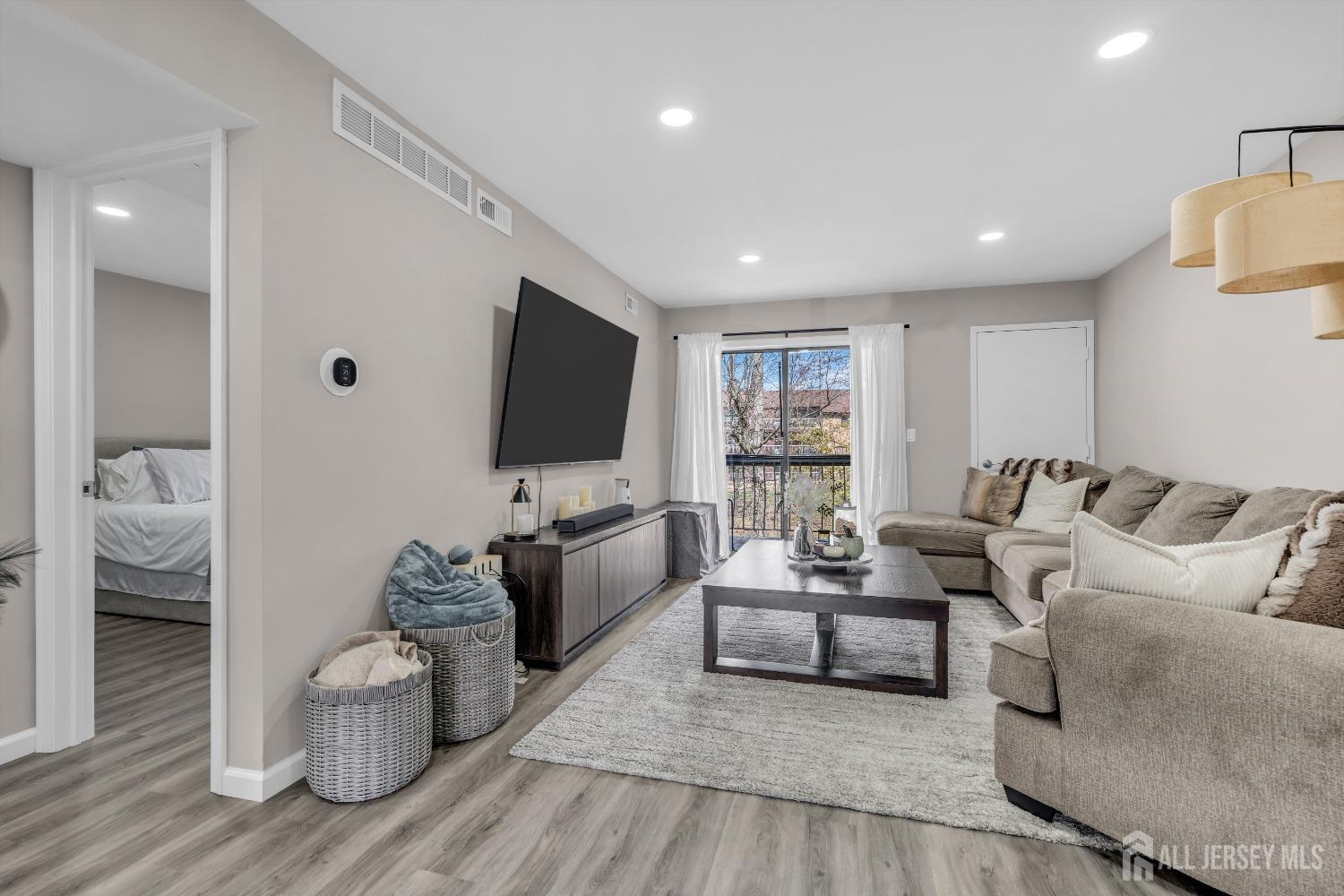 1933 Raspberry Court Edison, NJ 08817 - Photo 18 of 30 a living room with furniture and a flat screen tv
