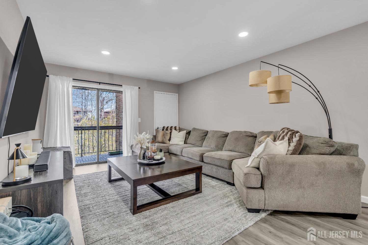 1933 Raspberry Court Edison, NJ 08817 - Photo 20 of 30 a living room with furniture and a flat screen tv